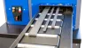 Rollenbahn der CREA-WHEEL 220 RRM mit mehreren Werkstücken nebeneinander, Flachstahl und Rundstahl